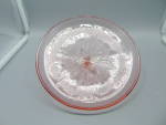 Jeannette Adam Pink Depression Glass Cover for Large Serving Bowl. The size is 7 5/8 in. from the outside edge. The edge has a floral design and the center of each has a large flower with a star shape...