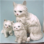 1960s Kelvin of Japan Persian Cat Trio.  Large one is 5 3/4" high.  One baby is perfect, mom has an ear tip chip and the paw up baby has an ear chip. <BR>