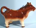 Occupied Japan Cow Creamer, 5 1/4" high.  Glaze craze visible on the white, otherwise excellent condition. 