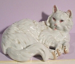 1950s Japan Porcelain Lying Persian Cat, 2 1/8" high x 5 1/8" long.  Japan copy of a Wein design, marked "SR-105", excellent condition. 