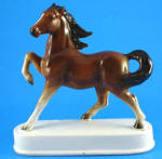 Beautiful 1960s Japan Ceramic Prancing Horse on Base, 6 1/8" high.  Pinpoint ear tip paint rub, otherwise excellent condition. 