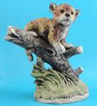 UCTCI Porcelain Leopard Cub on Branch, 6" high, excellent condition. 
