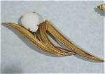 Sarah Coventry Goldtone Pin with Milk Glass Cabechon, 4 3/16" long, excellent condition. 