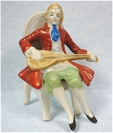 1940s/1950s Japan Ceramic Man on Chair, 3 1/2" high.  Marked "Made in Japan", excellent condition. 
