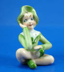 Occupied Japan Porcelain Sitting Pixie, 3" high.  Bits of an old souvenir decal on him, otherwise excellent condition. 