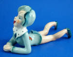 Occupied Japan Porcelain Lying Pixie, 2 1/4" high x 4 3/8" long.  Bits of an old souvenir decal on him, otherwise excellent condition. 