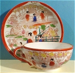 Japan Porcelain Cup and Saucer.  Cup 2" high, saucer 5 1/2" across, excellent condition. 