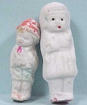 Two Vintage All Bisque Dolls.  Boy is 1 3/4" high, chip on foot, unmarked.  Bride is 2 1/16" high, marked Japan, chip on toe.
