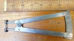 This is a unusual style vernier speed gage/caliper that is spring loaded for quick production inspections.  It is marked "CHICAGO DIAL INDICATOR CO. CHICAGO ILL."  Like most vernier gages, t...