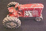 This is a 1950's vintage toy tractor. It is in good used condition with a good hitch, plastic tires, and steel axles. The paint is worn off in places, otherwise in good condition. It is 5" long x...