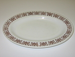 This 8" x 11 1/2" white glass oval plate has a brown (or deep red) scroll design on the rim. I believe this pattern may be called Filigree. It is in very nice, clean, used condition. It has ...