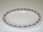 This 8" x 11 1/2" white glass oval plate has a brown (or deep red) scroll design on the rim. I believe this pattern may be called Filigree. It is in good, clean, used condition. It has no cr...