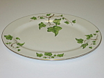 This platter is in nice, clean, used conditon with no chips or cracks.  It measures about 13 1/2" long and 9 3/4" wide. It does have some utensil marks and pattern wear from normal use.  The...