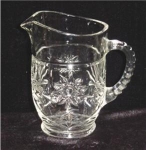 This is a Early American Prescut Small Milk Pitcher. It measures 5 3/4" tall. It is in good condition, no chips or nicks. 