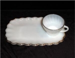 This is a Anchor Hocking Classic Milk Glass Snack Set complete with snack tray and cup. The tray measures 10 1/2" x 6 1/2", and the cup is 2 1/2" tall. There is some wear in gold due to...
