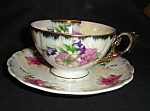 This is a Japan Luster Cup and Saucer Set. The cup measures 2.25" tall and is 3.75" in diameter. Good condition, no chips or nicks.