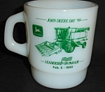 This is a Milk Glass John Deere Mug. It is marked "Galaxy Made in Mexico" on the bottom. The mug is marked Cannon Equipment corp. on the back side of the mug. The mug measures 3.5" tall...
