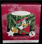 1997 Hallmark Ornament Donald's Suprising Gift is #1 in the Hallmark Archive Series. Mint in box. FREE SHIPPING WITHIN USA!!!