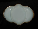 This is a Fire King milk glass relish dish with gold trim. It measure 11" x 7 1/2". Good condition.