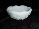 This is a very nice Milk Glass desert bowl. It measures 4 1/2 inches tall x 4 1/2" across. It is in good condition. No chips, nicks or cracks.