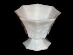 This is a Milk Glass Planter with the Panel Grape Pattern. It measures 5" tall x 5 1/2" in diameter. Good condition, no chips or nicks.