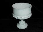 This is a Milk Glass Compote. It measures 6" tall and is 4 3/4" in diameter. Good condition, no chips or nicks.