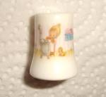 This is a Hallmark Betsey Clark Thimble. It is marked on the inside "Betsey Clark 1983 Hallmark Inc." It is marked on the back "Caring is a Gift". It measures 1" tall and is i...