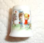 This is a Hallmark Little Gallery Thimble. It is marked 1980 Joan Walsh Anglund on inside of thimble. It is marked "Friends" on back of thimble. Measures 1" tall and is in good conditio...