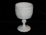 Wonderfully detailed Milk Glass Compote. I am not sure of the manufacturer on this item. It measures 6 1/2" tall x 4" in diameter. It is in excellent shape. 