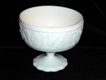 Wonderfully detailed Milk Glass Compote. I am not sure of the manufacturer on this item. It measures 5 1/2" tall x 6 1/4" in diameter. It is in good condition, no chips or nicks.
