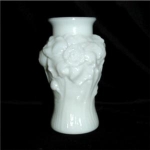 This is a Vintage Milk Glass Flower Vase. The maker is unknown. It measures 5 1/4" tall, and is in good codnition. No chips or nicks.