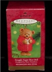 2001 Snuggly Sugar Bear Bell Hallmark Ornament designed by Mary Hamilton. This ornament is made of porcelain and is still in the box. FREE SHIPPING WITHIN USA!!!