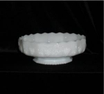 This is a Fire King Milk Glass Footed bowl. It is the panel grape pattern. It measures 3 1/2" tall X 9 1/2 in diameter. Good condition, no chips or nicks.