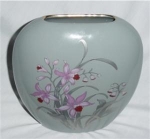 This is a pretty Japan Fine China Vase with floral design. It is in good condition, no chips or nicks.