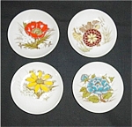 This is a set of 4 Miniature Floral Design Plates made in Japan. They measure 3.5" in diamter and are in good condition, no chips or nicks.