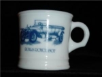 This is a Surrey  Milk Glass Mug with a picture of a 1907 Rolls Royce on it . It is marked Surrey made in USA on bottom. It measures at 3 1/4" tall, and is in good condition.
