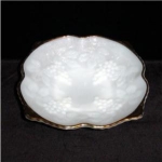 This is a Milk Glass Grape Vine Pattern Bowl with gold trim. It measures 8 1/4" in diameter, and 2 1/2" tall. It is in good condition, with some wear on gold. No chips or nicks.