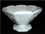 This is a beautiful milk glass footed bowl with the grape and vine pattern.  Measures 5 1/4 inches tall x 9 inches in diameter. Good condition, no chips or nicks.