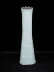 This is a Milk Glass Bud Vase with square bottom. It measures at 8 1/2" tall and is in good condition.