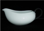 This is a Kyoto Gravy Boat that is made in Japan. It measures 2 3/4" tall and is 8" long. Good condition, no chips or nicks.