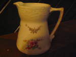 Vintage La Francaise Porcelain Cream/Milk Pitcher,off white with pink roses,6" tall and 6" wide spout to handle.Good condition shows age ware browing.