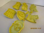Vintage Stanley Home Yellow Plastic Cookie Cutter Set, 1 Santa head, 1 snowman, 1 rocking horse, 1 angel, 1 drum. 1 spaceman, and 1 valentine heart. includes shipping within the USA.