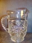 Anchor Hocking Crystal Early American Pressed Cut Glass Milk Pitcher, in the star pattern by Anchor Hocking. Pitcher is 6" high. Very good condition. No chips, cracks or discoloring.Price is for ...
