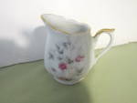  Vintage Japan China Mini Creamer Pink Floral Design. White base with gold trim. Pink and green floral design. Very good condition, no chips or cracks, price is for one. Very cool to display or use.