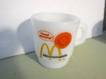 Vintage Anchor Hocking McDonald's Good Morning Cup. Milk white with orange/yellow design. Good condition, price is for one. On bottom Ovenproof #312 Made in the USA.
