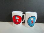 Avon Charlie Brown & Snoopy Milk Glass Mugs. Flying Ace Snoopy on red background, and Charlie on blue background. Cup is 3.5" tall, price is for set. United Features Good condition. 