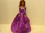 Disney Fashion Doll Walt Disney's Beauty Belle long brown hair, blue eyed doll. Movable head, waist, arms and legs. She is dressed in long purple gown with silver bow and is wearing purple shoes. She ...