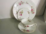 Vintage Fine China Of Japan Royal Rose 4-piece place setting, white with pink roses and green leaves. Dinner plate, salad plate, cup and saucer. Very good condition, price is for set. 