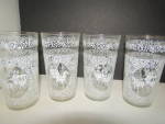  Vintage Colonial Victorian Carriage Tumbler Set, Clear glass with white lace like design, horse and carriage in white. Has gold trim around top.  Very good condition, price is for set of four glasses...