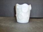 Milk Glass Toothpick Holder in a Floral Pattern. Holder has like daisy and vines with a ruffled edge. Holder stands 2.5" tall. There are rings on the bottom. Very good condition. No chips or crac...
